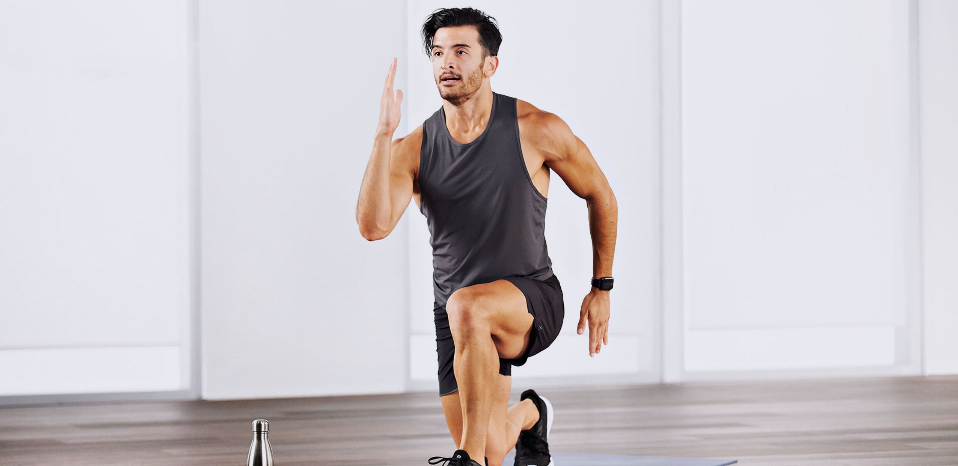 man doing lunges on a yoga mat